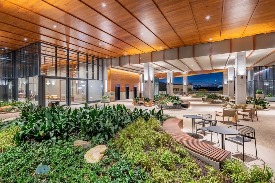 Anthem Midtown garden atrium with plants, seating, and natural lighting, featured in exterior commercial architecture photography.