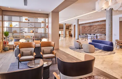 Lobby at Salt Lake City Hyatt with contemporary lounge furniture, open shelving, and marble floors.
