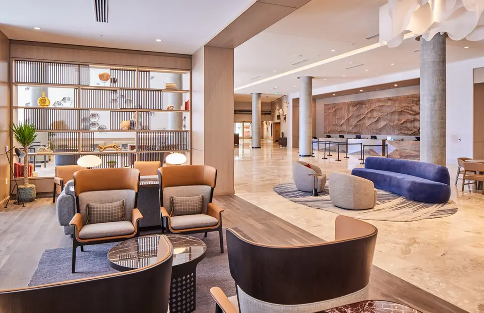 Lobby at Salt Lake City Hyatt with contemporary lounge furniture, open shelving, and marble floors.