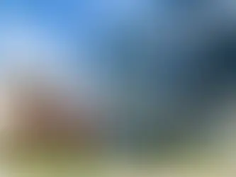 Wide angle photograph of large glass paneled buildings and surrounding exterior architecture