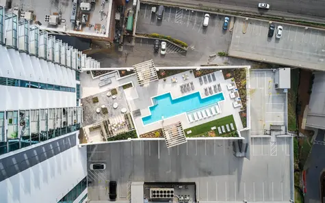 Overhead view of ICON Midtown rooftop pool and deck, taken for exterior architectural photography focused on commercial design.