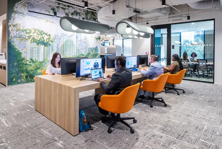 Interior architecture photography of a modern collaborative office with bold interior design elements and commercial workstations.