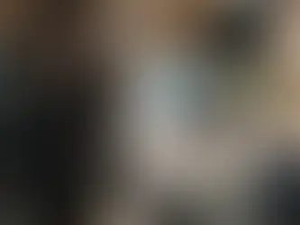 Picture Productions camera crew films a man under studio lights in a modern office for a professional video shoot.