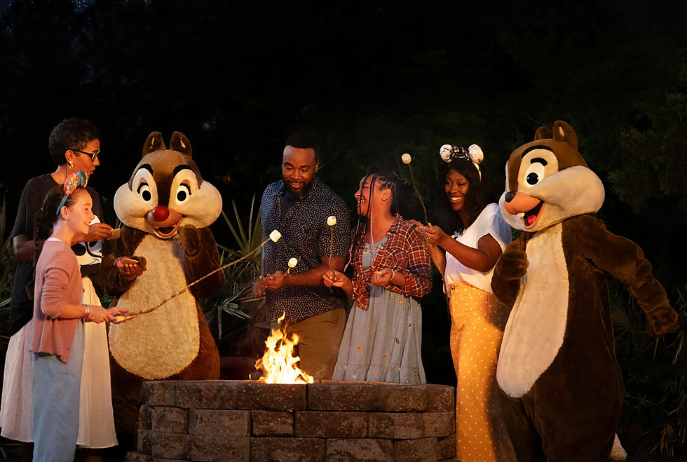 Family of 4 making stores with chip and dale Disney characters over a fire