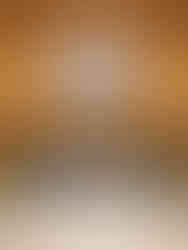 classy resort entrance with a 3 tiered lit chandelier above the main valet entrance looking at the large glass windows and doors to the lobby entrance