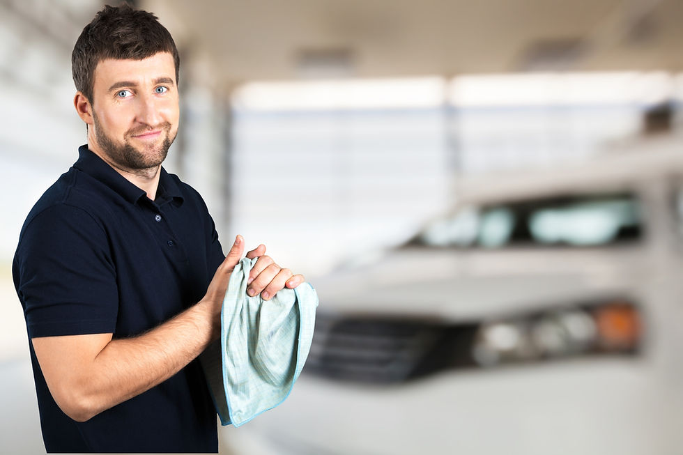 An automotive repair shop owner smiling because he is happy about his shop finanicals being in order using DriveYourKPI's program.