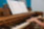 Close Up Of Piano with Sheet Music Sitting On Top