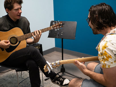 Adult Student In Guitar Lesson