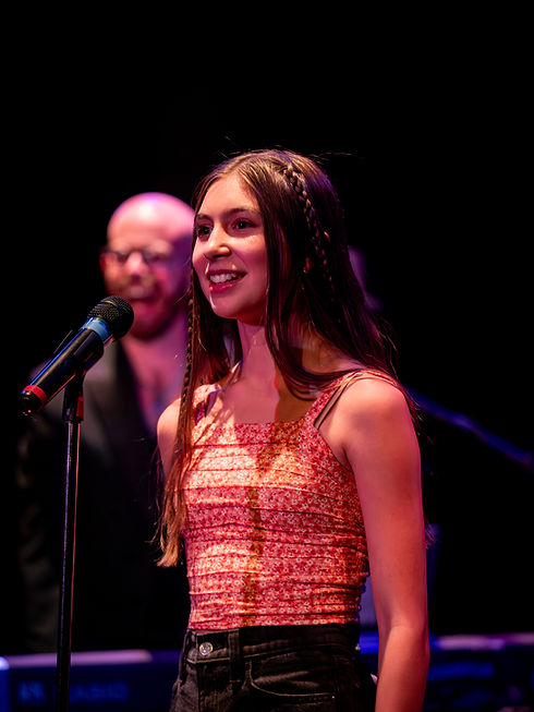 Girl Singing On Stage
