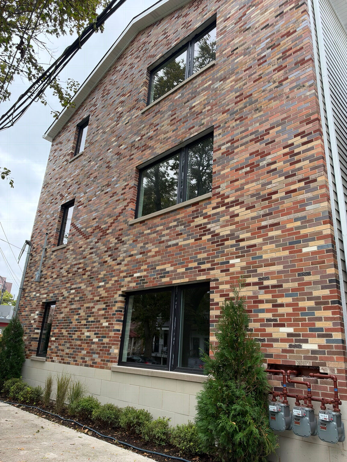 Multicolored brick exterior with dark-framed windows