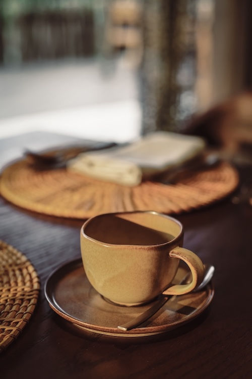 Mindful coffee break at The Merchant Hoi An, featuring sustainable tableware for events and gathering packages.