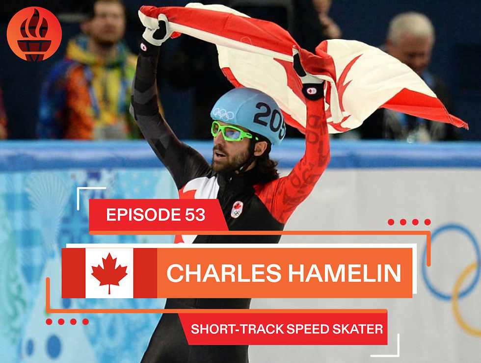 Charles Hamelin celebrating with a Canadian flag
