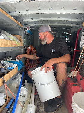 Experienced plumber Robert Miller inside an On Point Plumbing work van. The image showcases over 30 years of expertise and the professional tools used for local Summerville plumbing services.