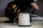 Woman electrician working with a role of 14_2 wire