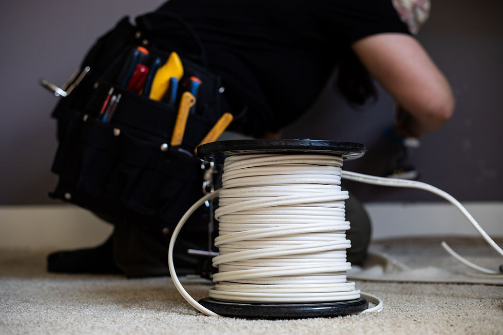Woman electrician working with a role of 14_2 wire