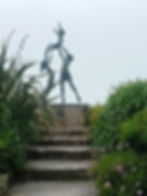 Photo of Sculpture by David Wynne of three children playing in Abbey Gardens, Tresco, Ilses of Scilly