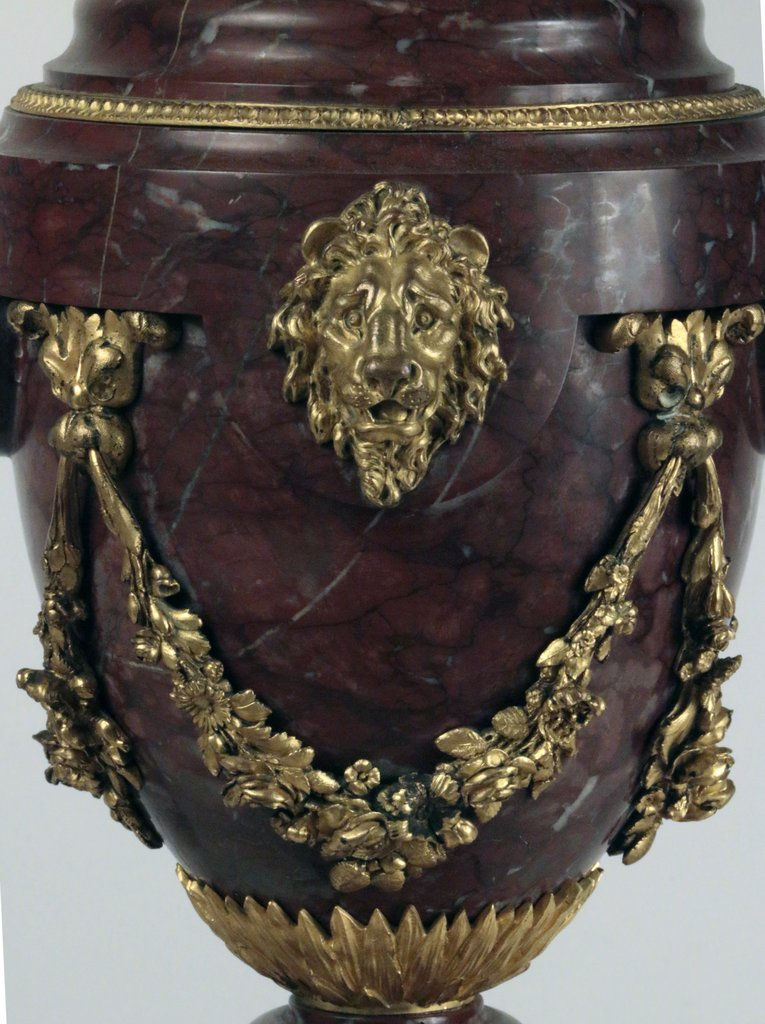 Thumbnail: A pair of rouge marble and gilt bronze baluster shaped oil lamps