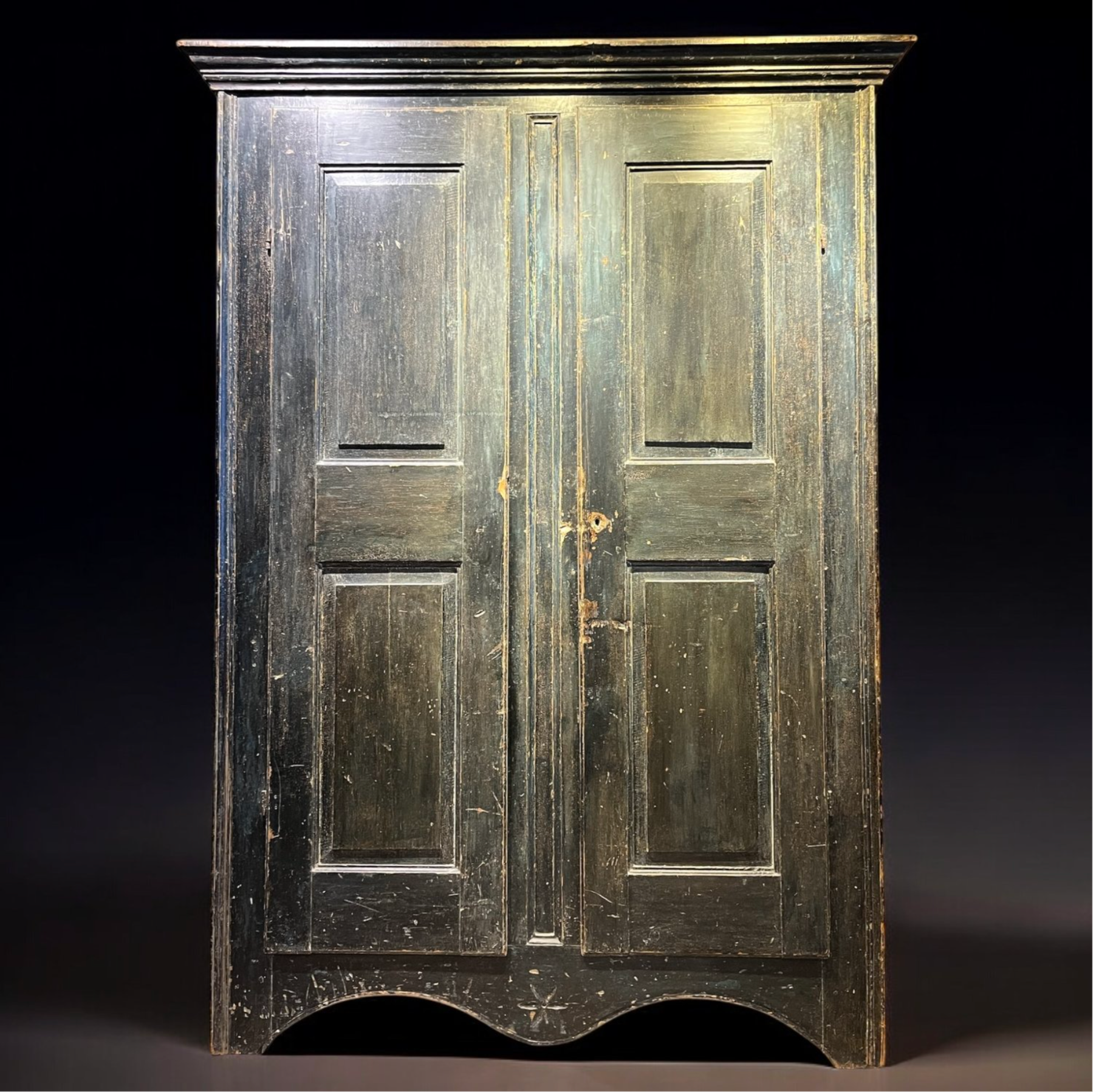 An early 19th C Canadian pine cabinet with 8 raised panels, Quebec c1800-1830