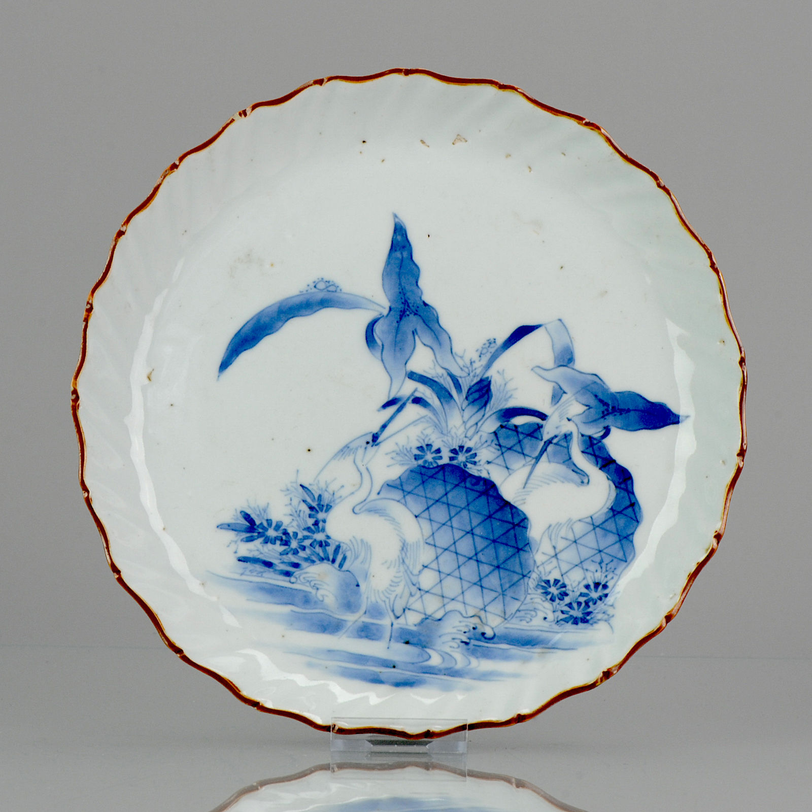 A very fine 17th C Japanese blue & white pie-crust dish, herons in a lotus pond