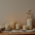 just create a wallpaper with luxury candles, Creamish and light beige tones and candles gl