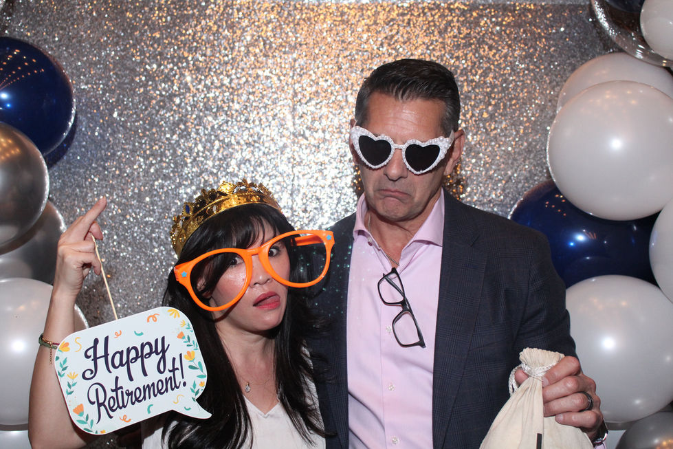 Wedding guests enjoying photo booth props at a Las Vegas reception
