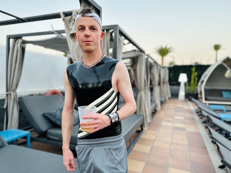 gay man in rubber outfit at maspalomas fetish week