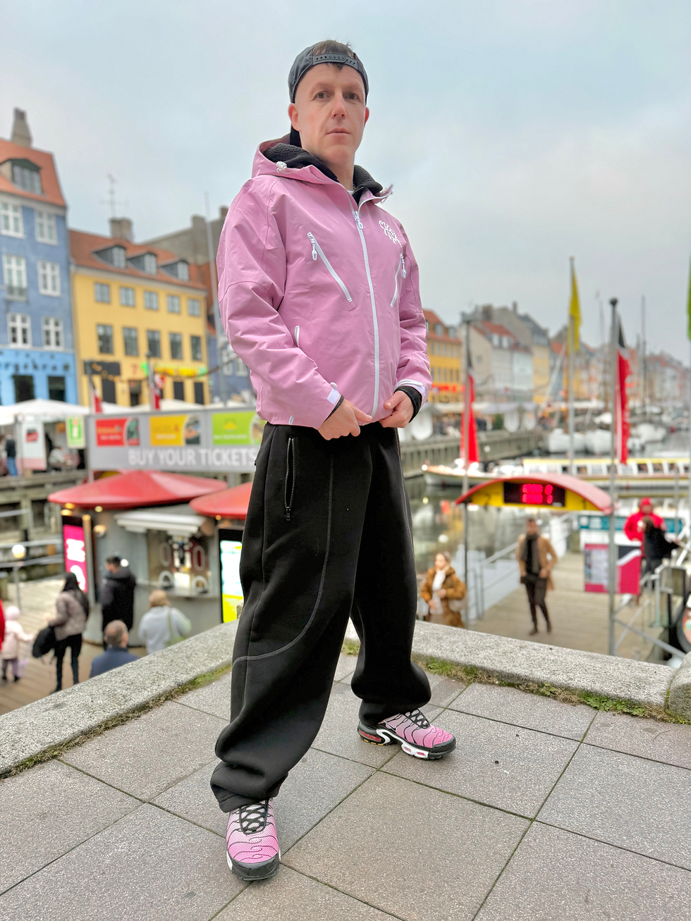 gay boy wearing sportswear and mertra jacket in copenhagen