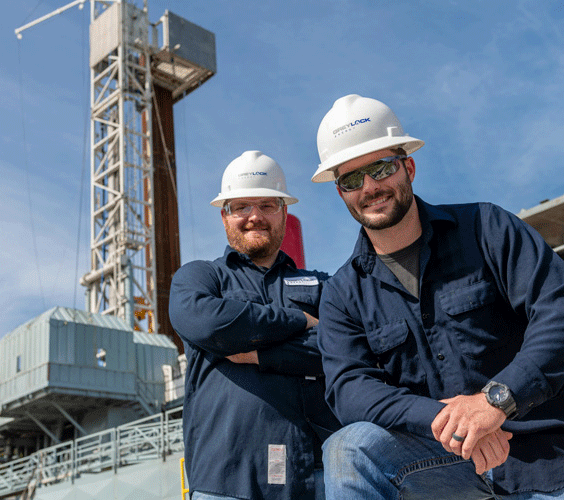 Two engineers and a drilling rig