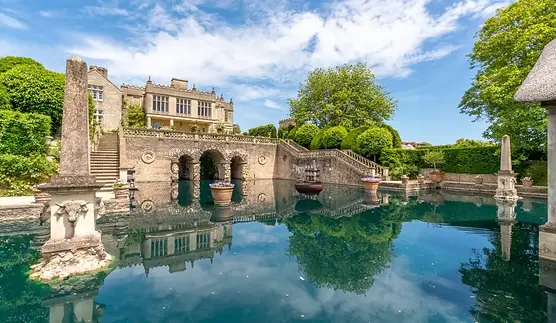 Peaceful castle by a reflective lake, symbolizing ongoing support throughout your planning journey.