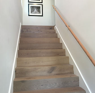 Modern NYC interior staircase design inspiration with oak wood steps and minimalist railing