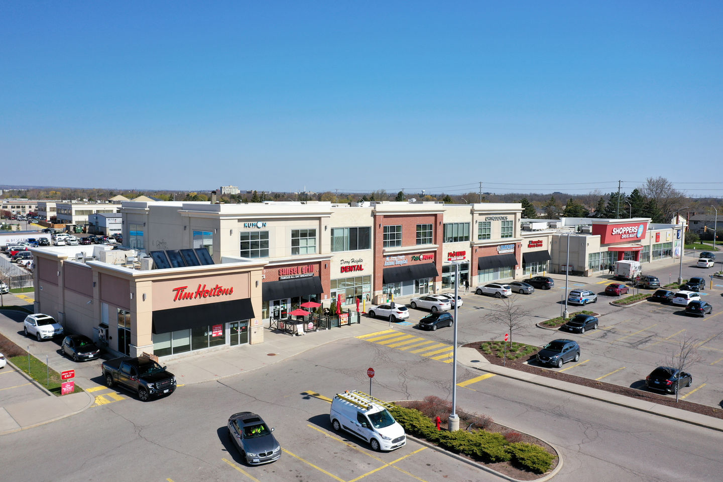 Tim Hortons plaza, sunny day, ample parking
