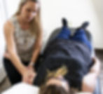 Therapist working on patient's arm during lymphedema therapy