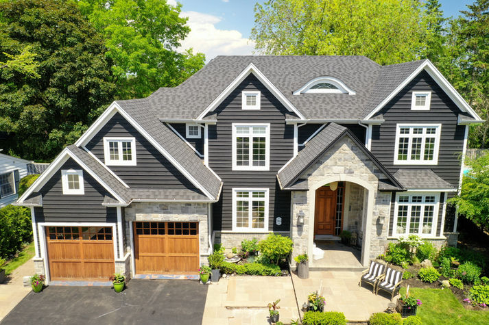 Luxury home exterior, gray siding, attached garage, Real Estate Photography