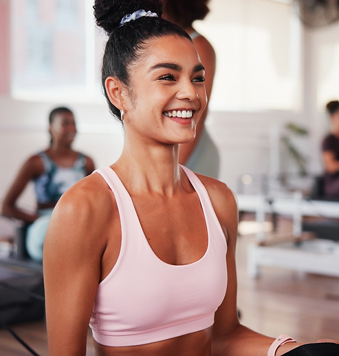 Smiling girl on reformer