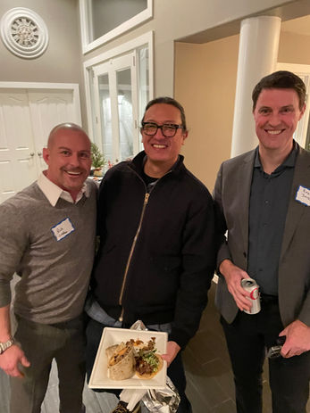 Three men smiling for a photo