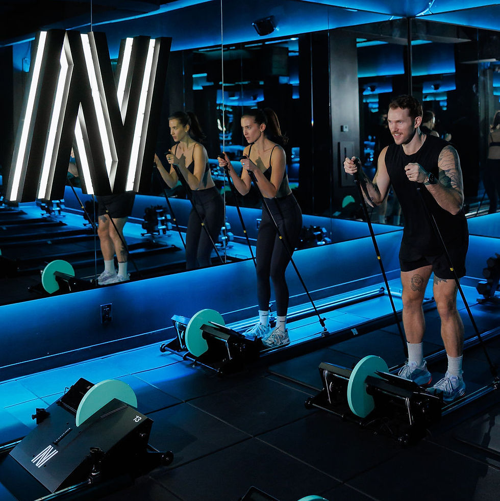 People exercising in a gym with weights and