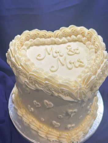 Lambeth heart cake with white buttercream finished with hand piped details