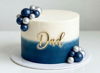 Blue & white buttercream cake, acrylic dad topper with foam blue and silver decorative balls