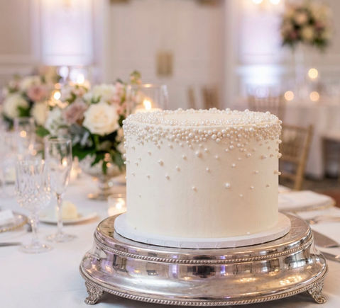 8" buttercream single tier cake with sugar pearl detail