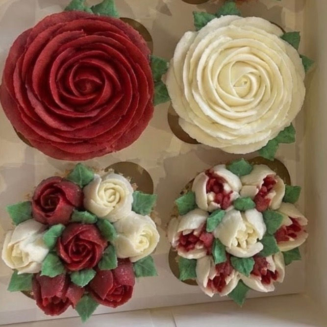 Thumbnail: Close-up of Valentine’s Day cupcakes decorated with floral buttercream in deep reds, creams