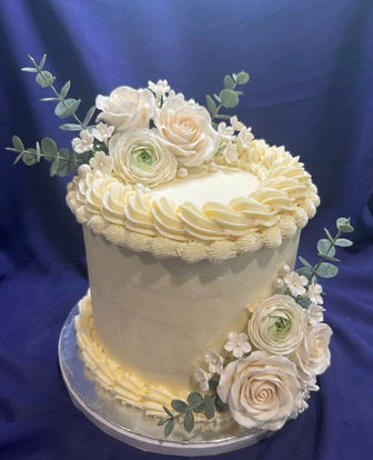 Lambeth style buttercream cake, white roses and foliage decorations