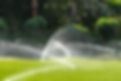 irrigation-system-watering-the-green-grass-blurre-2026-03-26-00-45-43-utc.jpg