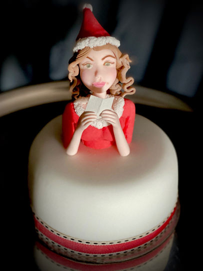 Small Christmas Cake with a Mrs Santa Claus Sugar paste Topper