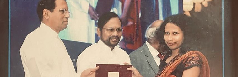 Dr. Roshini receiving her presidential award (2016)