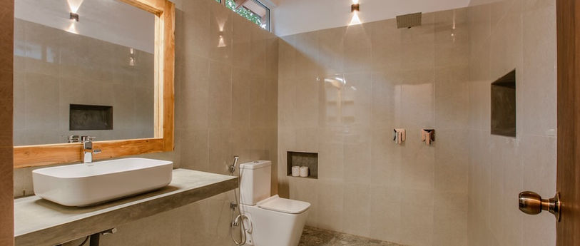 Bathroom with large mirror and hot water shower.jpeg