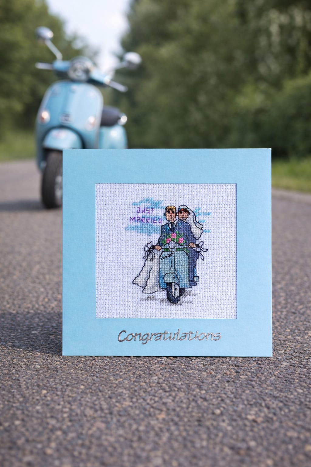 handcrafted Wedding card of a couple on a moped bike