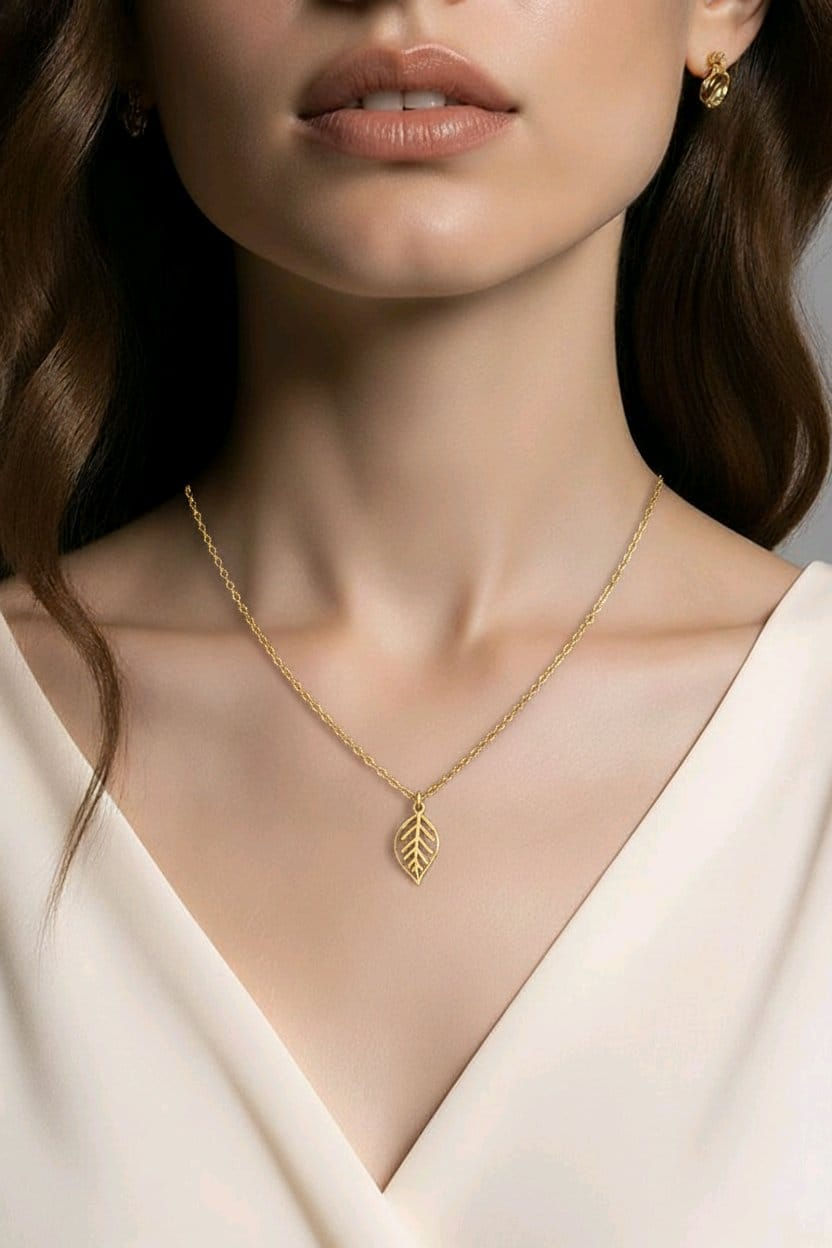 Thumbnail: Handcrafted gold necklace, featuring antique gold leaf pendant