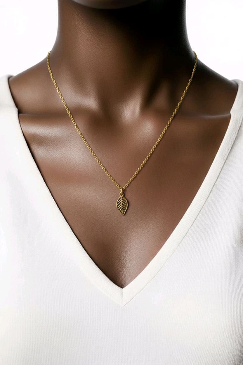 Handcrafted gold necklace, featuring antique gold leaf pendant