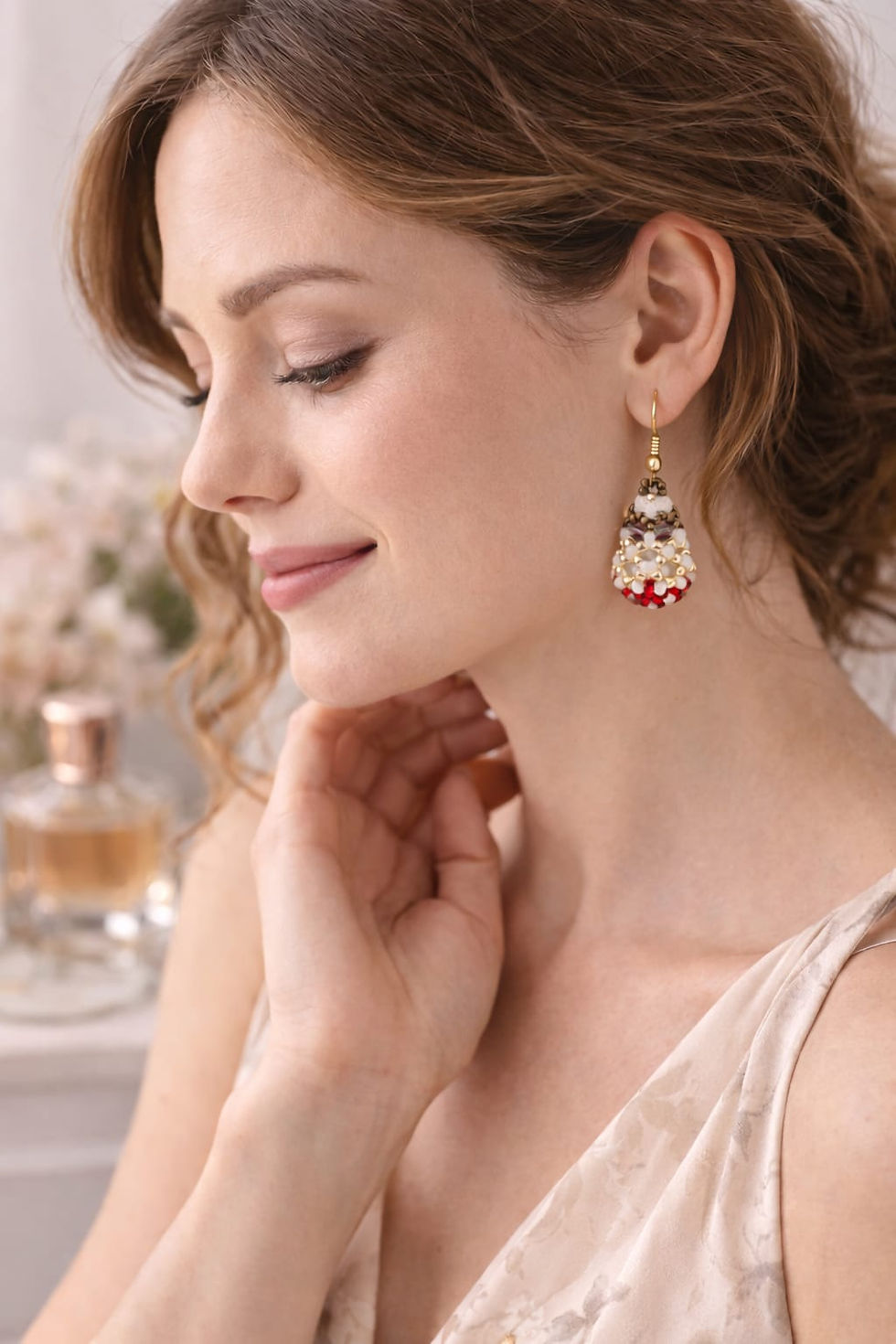 Thumbnail: Handmade red, gold, and white beaded earrings