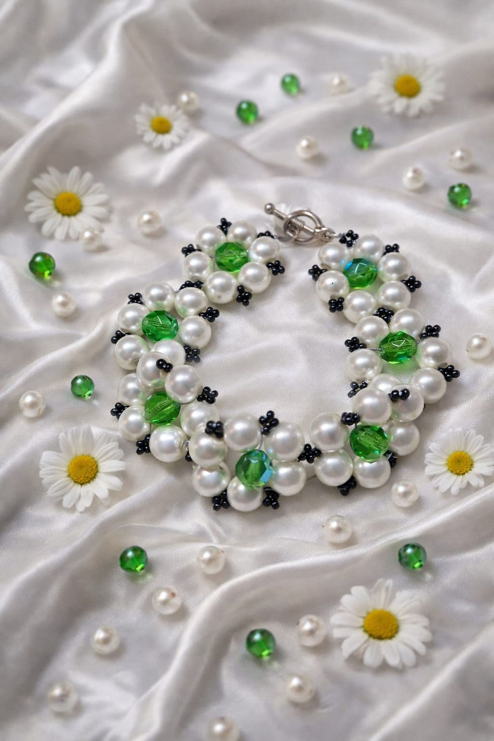 Thumbnail: Handmade flower bracelet using white pearls, green and black beads
